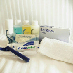 Female Hygiene Kit - Razor, toothbrush, toothpaste, shave cream, deodorant, mouthwash, shampoo, conditioner, soap, sanitary pad, washcloth.