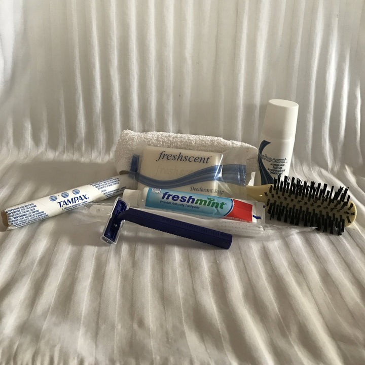$2.76 Hygiene Kit - Tampon, toothbrush, toothpaste, washcloth, soap, razor, deodorant, brush.
